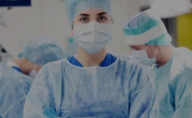 female surgeon performing a procedure in an operating room
