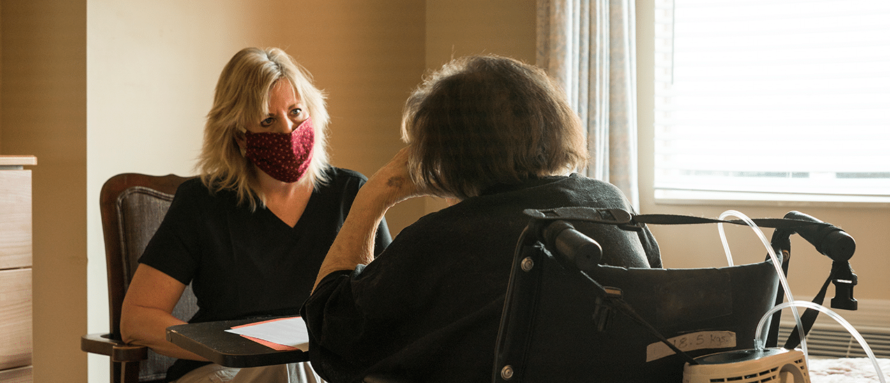 Woman having conversation with senior